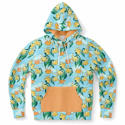 A flat lying hoodie. The hoodie's pattern features cute cat faces and daffodils on a blue background. The pocket and lining of the hood are orange