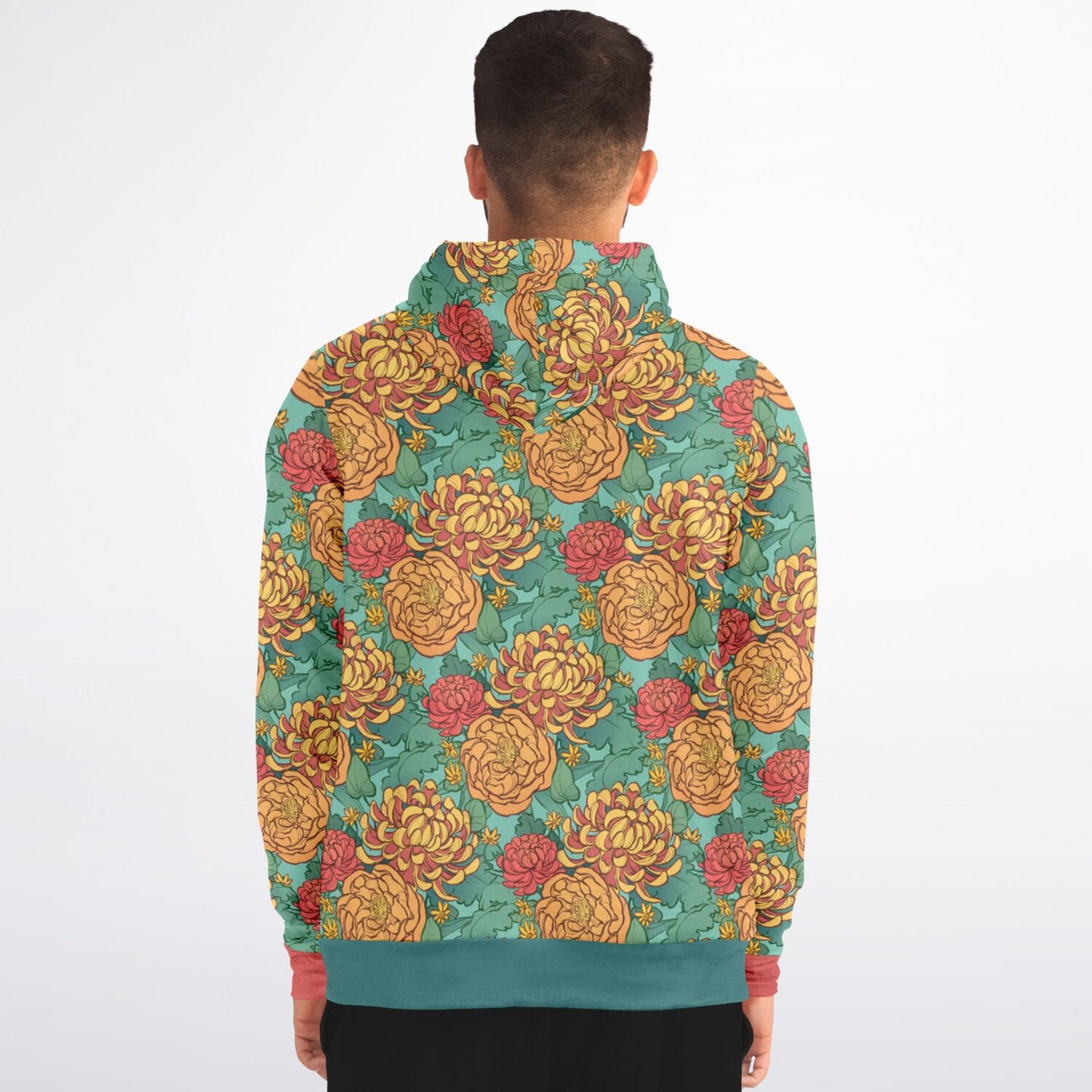 A model wearing a hoodie. The hoodie's pattern features yellow and red chrysanthemums, and orange peonies on a green background.