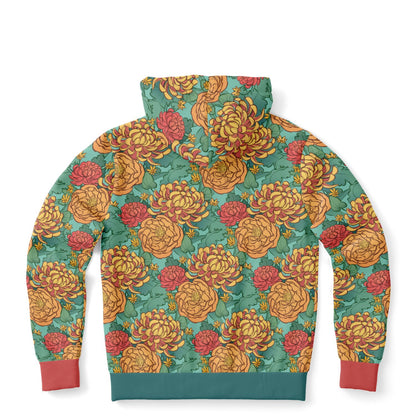 The back of a hoodie lying flat. The hoodie's pattern features yellow and red chrysanthemums, and orange peonies on a green background.