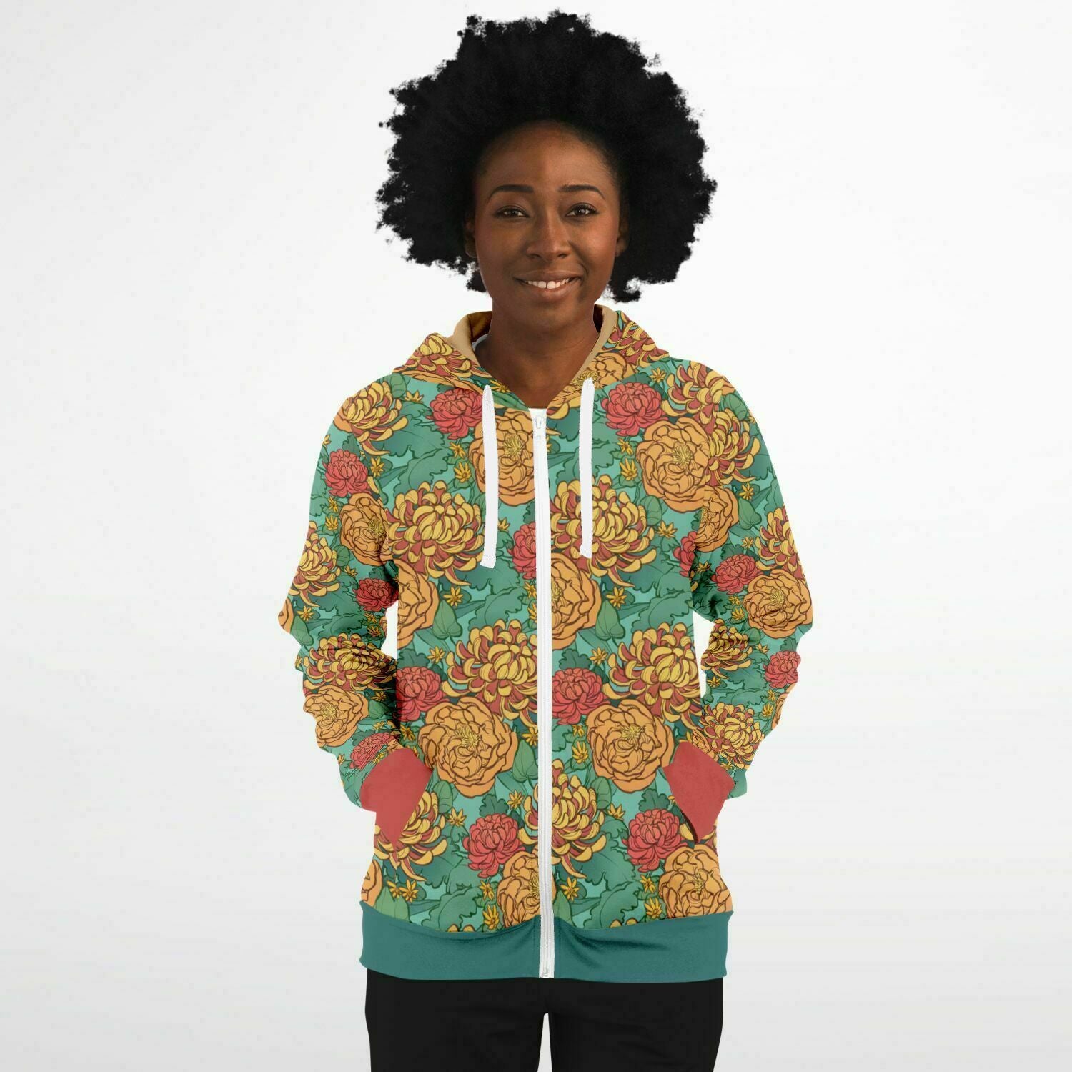 A model wearing a hoodie. The hoodie's pattern features yellow and red chrysanthemums, and orange peonies on a green background.