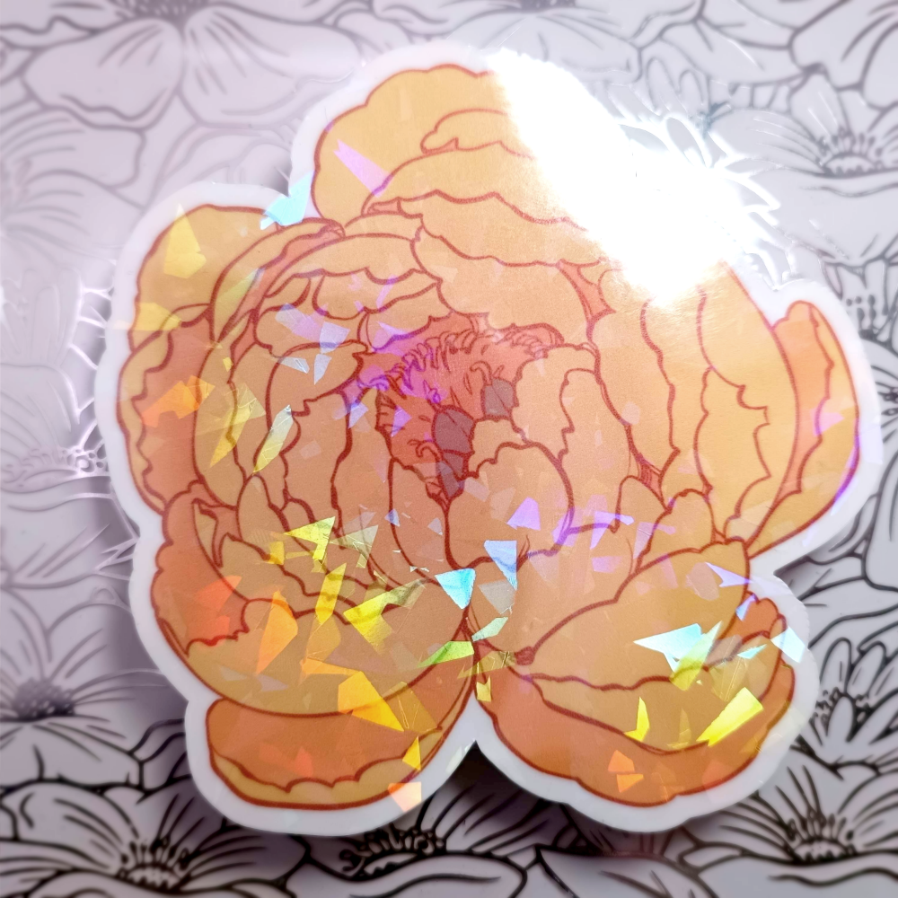 A sticker of a yellow-orange peony flower with holo flowers.