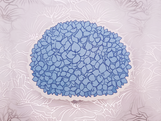 A matte sticker of a blue Hydrangea.