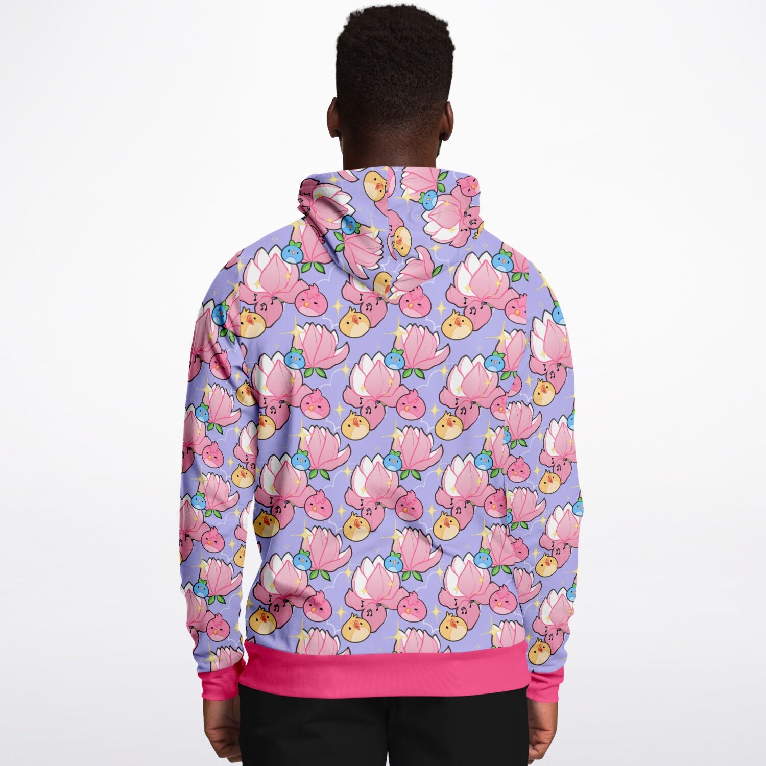 A model wearing a hoodie. The hoodie's pattern features cute round birds and magnolia on a purple background. The trims are pink. 