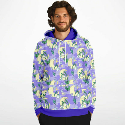 A model wearing a hoodie. The hoodie's pattern features bunnies, snowbells, and the moon. It has a purple smokey background.