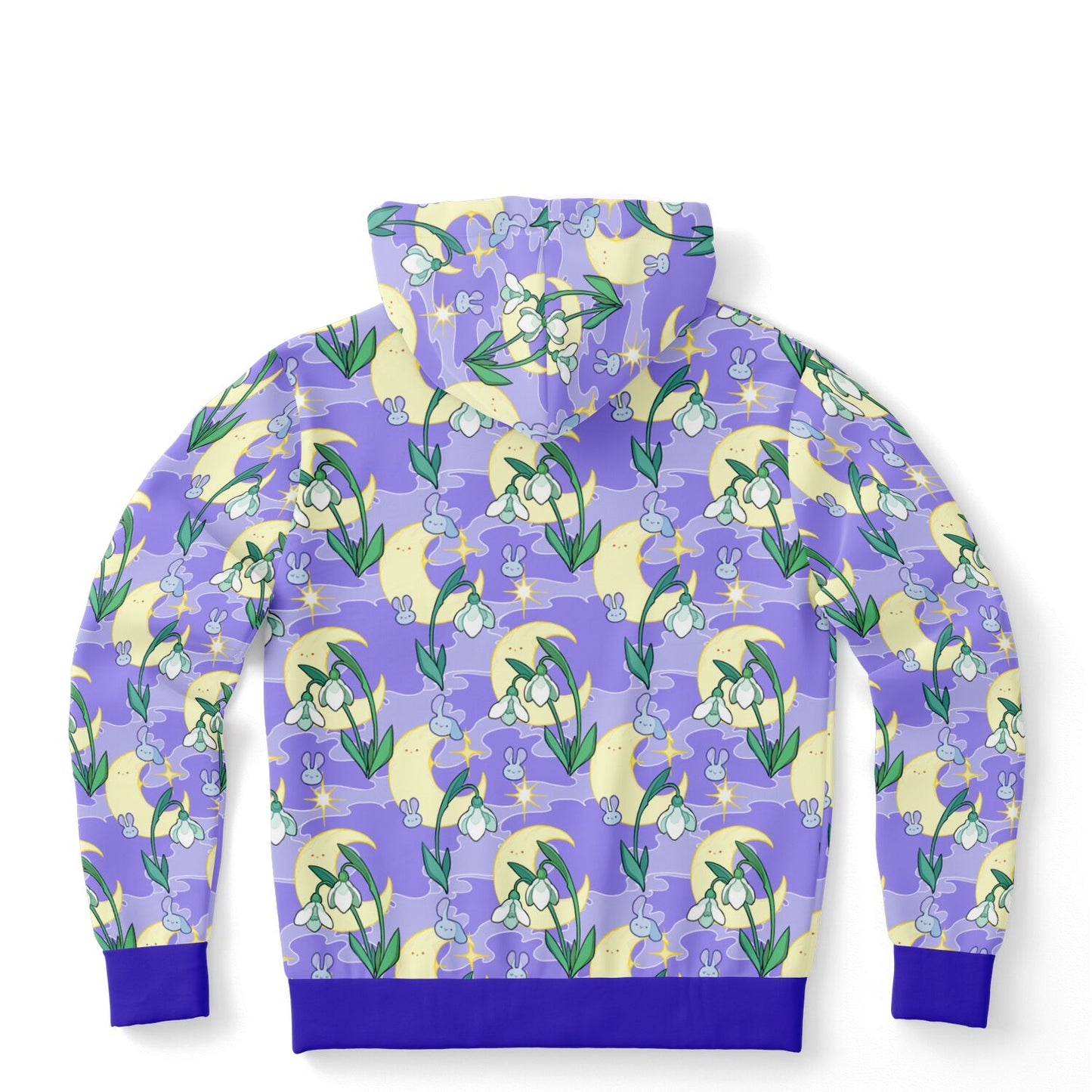 A flat lying hoodie. The hoodie's pattern features bunnies, snowbells, and the moon. It has a purple smokey background.