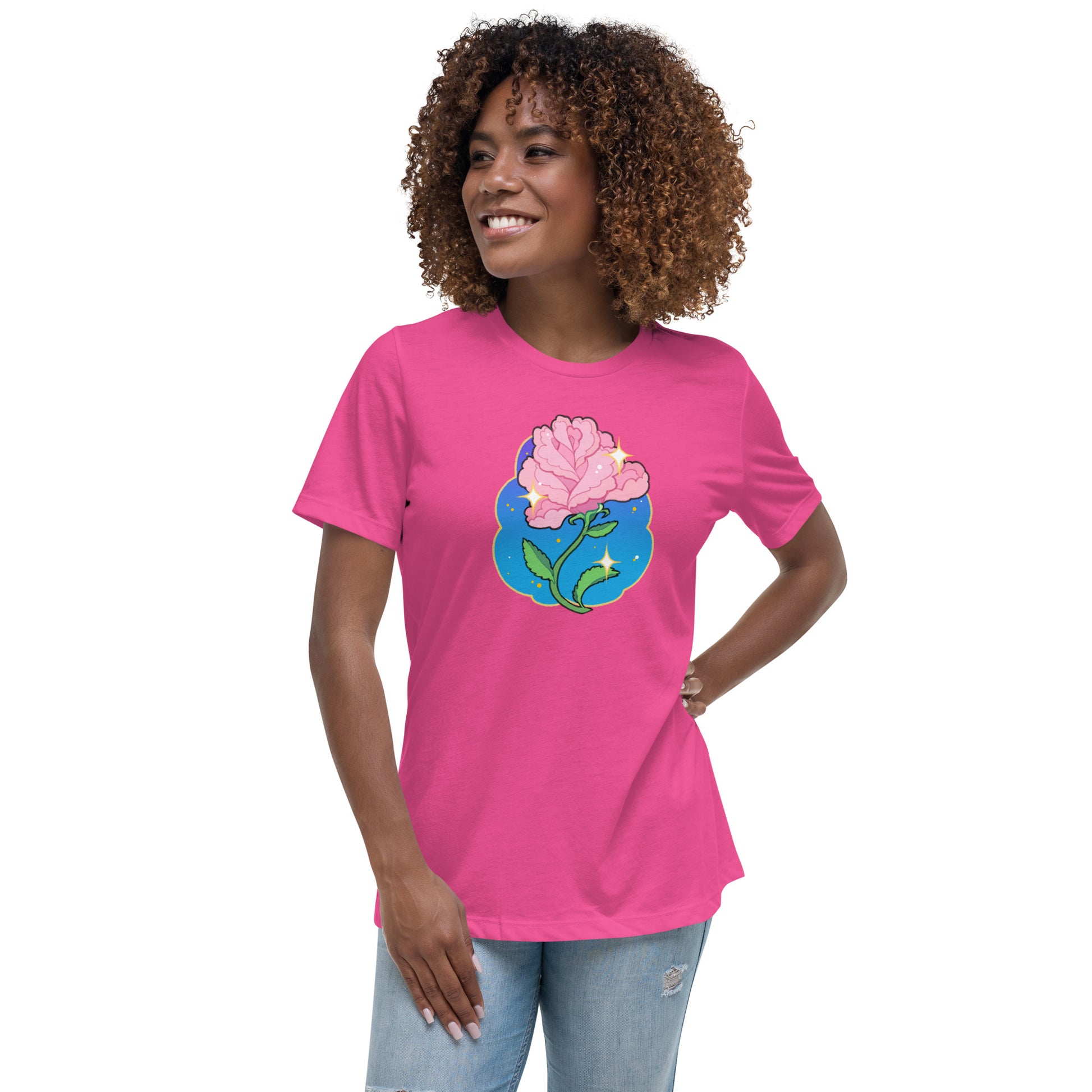 A model wearing a pink tshirt. It has a print of a pink rose flower on the front.