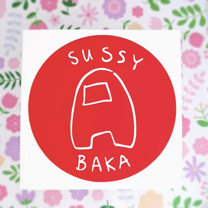 Round vinyl sticker of an among us bean in a scribbled style. It reads sussy baka.